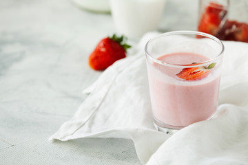 Homemade organic fresh raspberry smoothie with kefir(yogurt,ayran,lassi,milky product) for dieting breakfast in glass on white background close-up with copy space for text.Summer healthy fruit drink