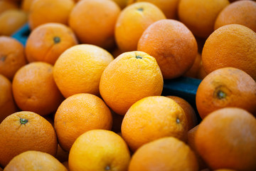 fresh oranges on market stall