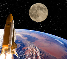 Rocket and moon. Earth on the backdrop. The elements of this image furnished by NASA.