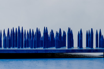 blue steel plate with iron spikes