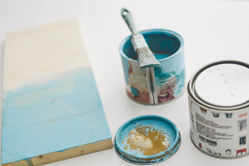 painting furniture, close-up hand with brush