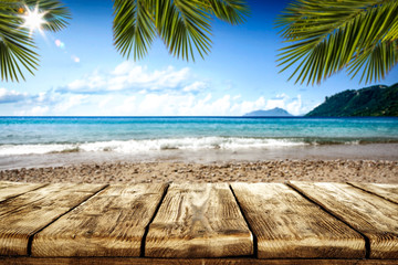 Desk of free space and summer beach background 
