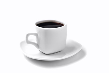 white cup of coffee on a white saucer; on a white background, angle view from above