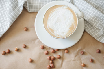 hot morning coffee and nuts on craft paper