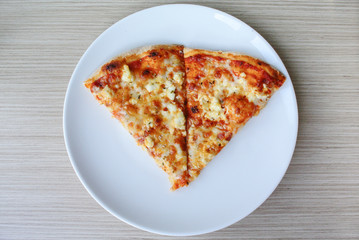 Italian pizza four cheese on white dish