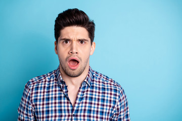 Close up photo disappointed frustrated annoyed guy frown open mouth stubble impressed astonished by incredible novelty rumor secret gossip dressed plaid spring modern outfit isolated blue background