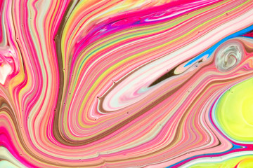 Abstract multi-colored paint background. Acrylic texture with marble pattern. Wallpaper. Mixing paints. Modern art.