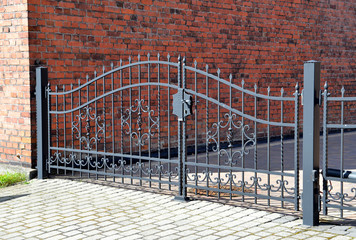 Forged iron gate outdoor, black grey fence.