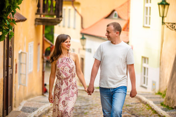 Naklejka premium Young couple walking in old town of Prague