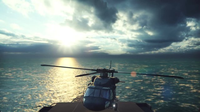 Military helicopter Blackhawk lands on an aircraft carrier on a clear day in the endless blue ocean