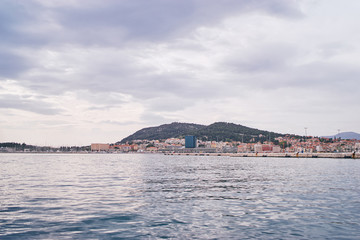 Travel by Croatia. Beautiful landscape with Split Old Town and sea promenade.