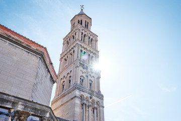 Fototapeta na wymiar Travel by Europe. Ancient Diocletian Palace, Tower and cathedral against blue sky in Split Old Town, Croatia.