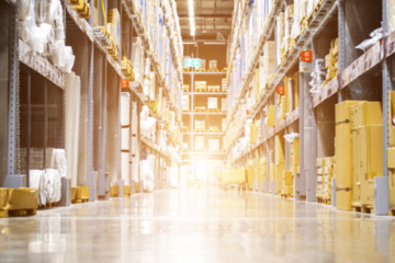 Huge distribution warehouse with high shelves and loaders, Rows of with boxes, Rows of shelves with boxes, Blurred business background, Blurred business background.