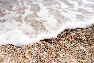 Sea wave and foam closeup.