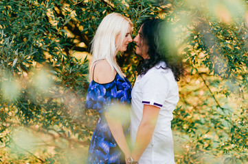Beautiful loving couple outdoor activity. Italian man with his caucasian girlfriend emotional relationships.