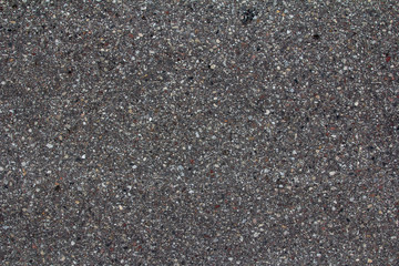Street asphalt texture. Rough road surface background. Abstract pavement pattern