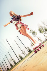 Laughing dark-haired girl in summer outfit being excited with riding