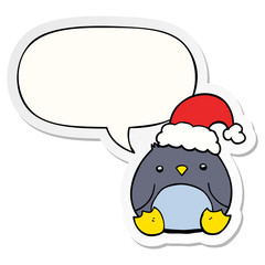 cute cartoon penguin wearing christmas hat and speech bubble sticker