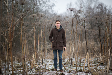 Portrait of man with a walking on a winter meadow