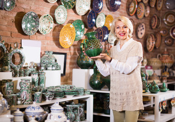 woman buying ceramic ware