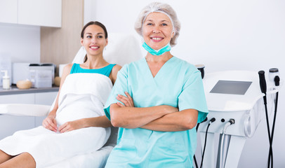 Obraz premium Professional mature beautician in medical esthetic office