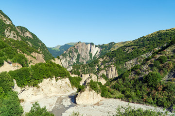Caucasus mountains covered with green forest
