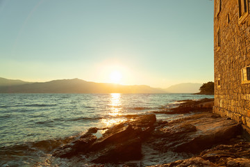 Beautiful sunrise near waterfront in a harbor of a small town Postira - Croatia