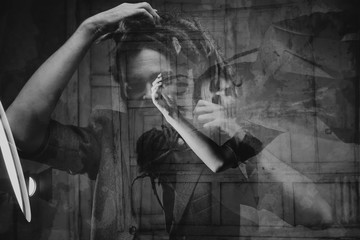 Double exposure. Male portrait. The guy with the dreadlocks. Multiple exposure and theatrical art.