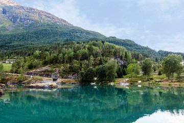 Naklejka na ściany i meble Calm lake near the mountain landscape