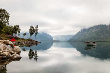 Scenic view of lonely boat on idyllic lake