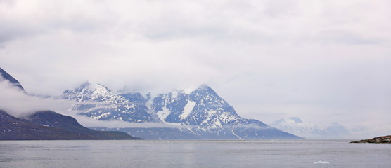 Fototapeta na wymiar Landscape Greenland, beautiful Nuuk fjord, ocean with mountains backgroun