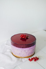 Chef cooking ceesecake with currant. Selective focus. New York Cheesecake.