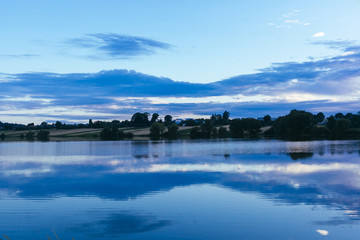 Reflection of sky over the idyllic lake