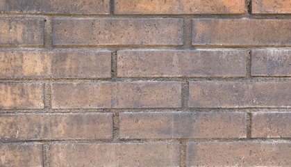 Brick wall of red color, panorama of the old wall. Modern architecture, antique styled materials. Vintage textured background with copy space.