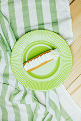 Homemade vanilla eclair on a white background. Traditional French dessert. Top view. Morning...