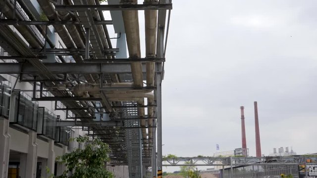 Slowmotion pan right over Eindhoven Factory District on a grey day
