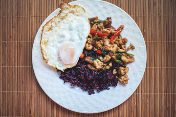 rice topped with stir-fried pork and basil