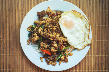 rice topped with stir-fried pork and basil