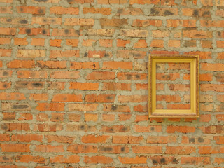 Picture frame from baguette on the background of an old brick wall