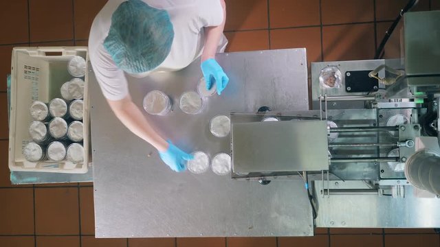 Top view of bread crumbs in containers getting piled up