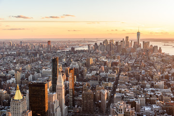 View from observation deck on Empire State Building at sunset - Lower Manhatten Downtown, New York...