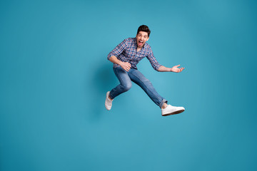 Full length body size view photo funny charming guy have free time holidays imagine rock star shout hold hand dream dreamy playful wear modern jeans outfit legs sneakers isolated blue background