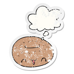 cute cartoon donut and thought bubble as a distressed worn sticker