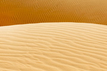 Sand pattern with shallow depth of field in the desert, UAE