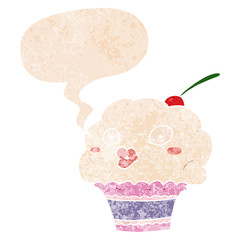cartoon cupcake and speech bubble in retro textured style