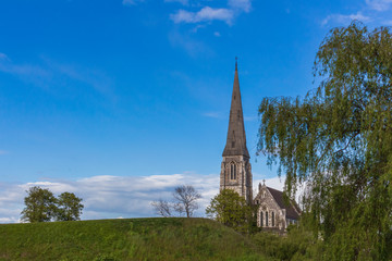 Fototapeta na wymiar Denmark, Copenhagen, St. Alban's church, English church, Anglican church summer time blue sky