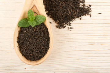 black tea on wooden background