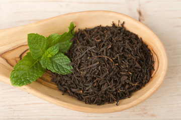 black tea on wooden background