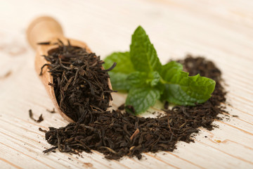 black tea on wooden background