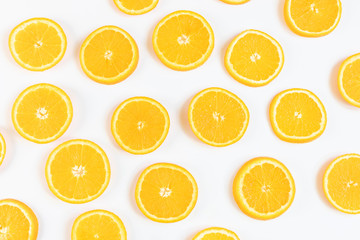 Fresh bright round orange slices. Shades of orange. Flat lay, top view, bright design. Fruit composition. Concept of vitamin C, healthy wholesome food.